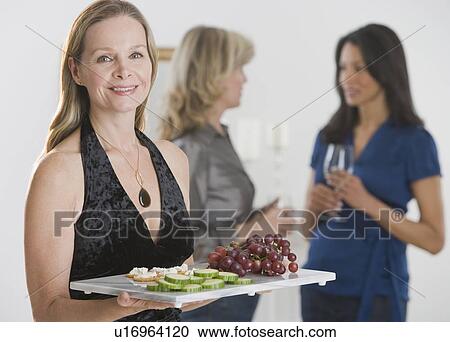 Woman carrying tray of hors d’ouevers View Large Photo Image Stock Image - Woman carrying tray of hors d’ouevers. Fotosearch
