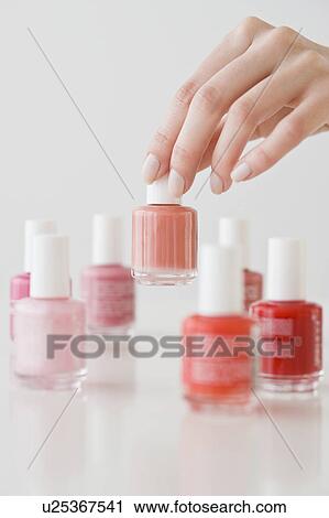 Woman choosing nail polish View Large Photo Image Stock Image - Woman choosing nail polish. Fotosearch