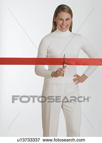 Woman cutting red tape View Large Photo Image Stock Photo - Woman cutting red tape. Fotosearch