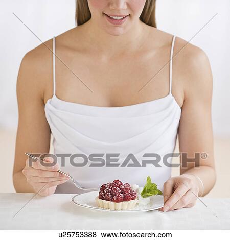 Woman eating desert View Large Photo Image Stock Photo - Woman eating desert. Fotosearch