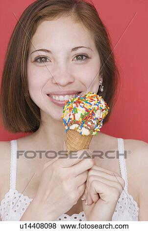 Woman eating ice cream cone View Large Photo Image Stock Photo - Woman eating ice cream cone. Fotosearch