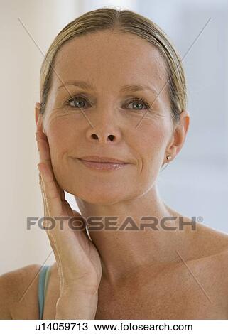 Woman hand on face View Large Photo Image Stock Image - Woman hand on face. Fotosearch