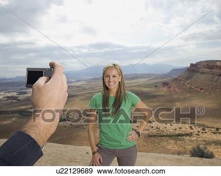 Woman having photograph taken View Large Photo Image Stock Photo - Woman having photograph taken. Fotosearch