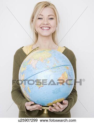 Stock Photo - Woman holding globe. Fotosearch