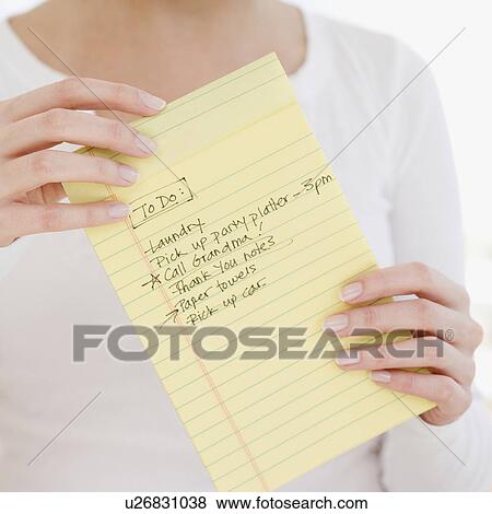 Woman holding To Do list View Large Photo Image Stock Photo - Woman holding To Do list. Fotosearch