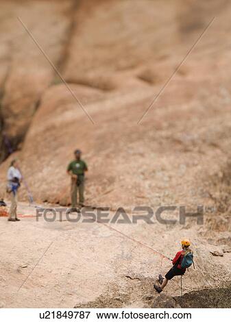 Woman in rappelling gear at top of cliff View Large Photo Image Stock Photo - Woman in rappelling gear at top of cliff. Fotosearch