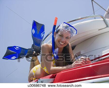 Woman in snorkeling gear on boat, Florida, United States View Large Photo Image Stock Photo - Woman in snorkeling gear on boat, Florida, United States. Fotosearch