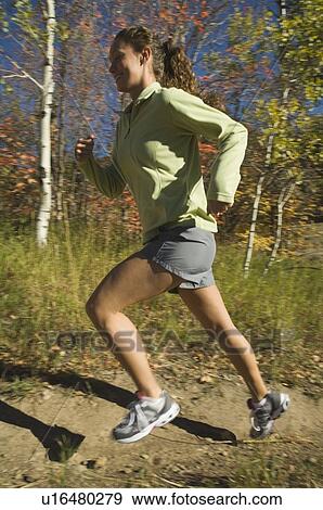 Woman jogging on trail, Utah, United States View Large Photo Image Stock Photo - Woman jogging on trail, Utah, United States. Fotosearch