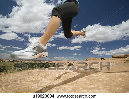 Woman jumping in desert View Large Photo Image Picture - Woman jumping in desert. Fotosearch