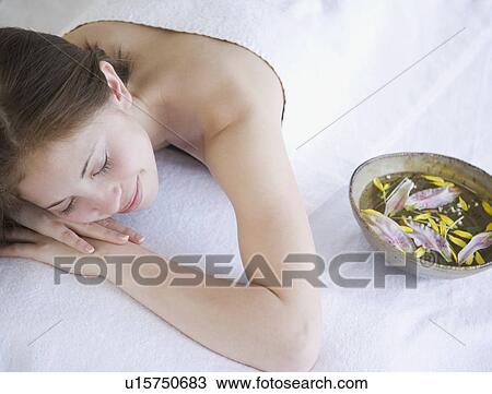 Woman laying on spa table View Large Photo Image Stock Image - Woman laying on spa table. Fotosearch