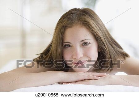 Woman laying on spa table View Large Photo Image Stock Photography - Woman laying on spa table. Fotosearch