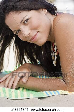 Woman lying on beach View Large Photo Image Stock Image - Woman lying on beach. Fotosearch