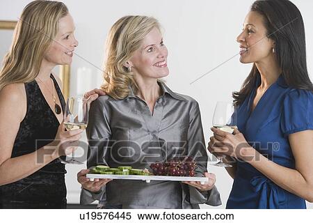 Woman offering tray of hors d’ouevers View Large Photo Image Stock Photography - Woman offering tray of hors d’ouevers. Fotosearch