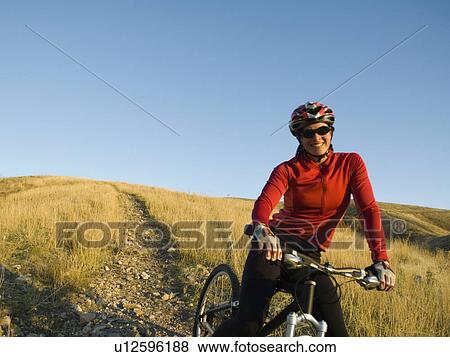 Woman on mountain bike, Salt Flats, Utah, United States View Large Photo Image Stock Photo - Woman on mountain bike, Salt Flats, Utah, United States. Fotosearch