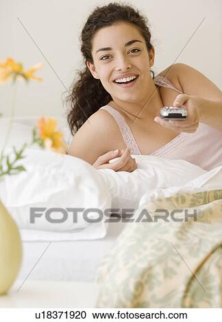 Woman pointing remote control View Large Photo Image Stock Image - Woman pointing remote control. Fotosearch