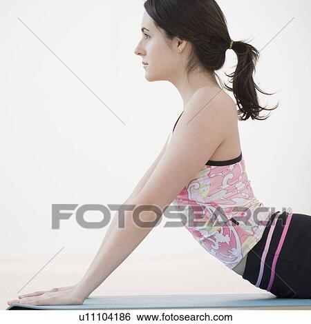 Woman practicing yoga View Large Photo Image Stock Photograph - Woman practicing yoga. Fotosearch