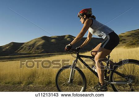 Woman riding mountain bike, Salt Flats, Utah, United States View Large Photo Image Stock Image - Woman riding mountain bike, Salt Flats, Utah, United States. Fotosearch