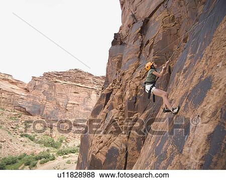 Woman rock climbing View Large Photo Image Stock Photo - Woman rock climbing. Fotosearch