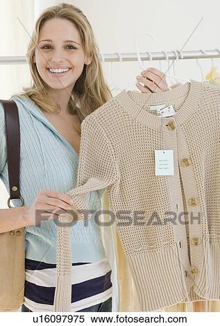 Woman shopping for clothing View Large Photo Image Stock Photography - Woman shopping for clothing. Fotosearch