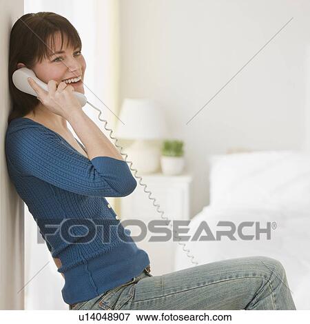 Woman talking on telephone View Large Photo Image Stock Photo - Woman talking on telephone. Fotosearch