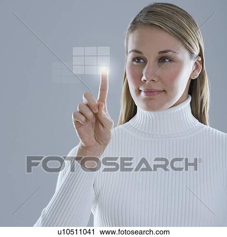 Woman touching lighted display View Large Photo Image Stock Image - Woman touching lighted display. Fotosearch