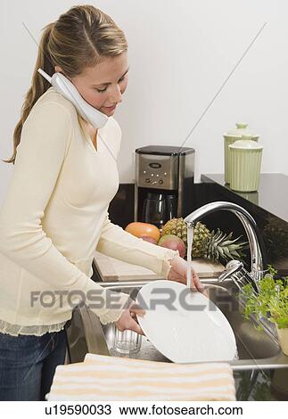 Woman washing dishes View Large Photo Image Stock Image - Woman washing dishes. Fotosearch