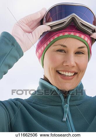 Woman wearing ski goggles View Large Photo Image Stock Photograph - Woman wearing ski goggles. Fotosearch