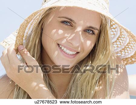 Woman wearing straw hat View Large Photo Image Stock Image - Woman wearing straw hat. Fotosearch