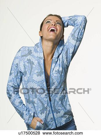 Woman wearing sweatshirt with hand behind head View Large Photo Image Stock Photo - Woman wearing sweatshirt with hand behind head. Fotosearch