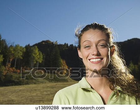 Woman with hair blowing outdoors, Utah, United States View Large Photo Image Stock Photo - Woman with hair blowing outdoors, Utah, United States. Fotosearch