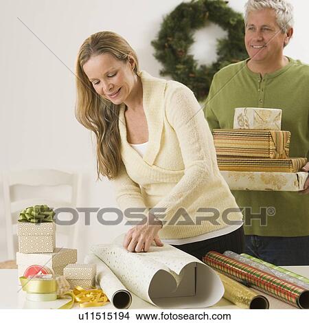 Picture - Woman wrapping gifts. Fotosearch