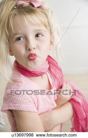 Stock Photo - Young girl playing dress-up. Fotosearch