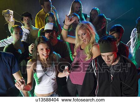 Young people at dance club View Large Photo Image Picture - Young people at dance club. Fotosearch