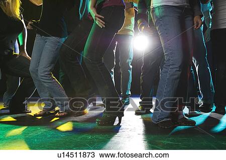 Stock Image - Young people at dance club. Fotosearch