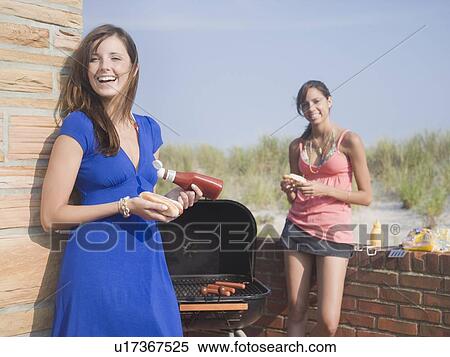 Young women at barbecue View Large Photo Image Stock Photography - Young women at barbecue. Fotosearch