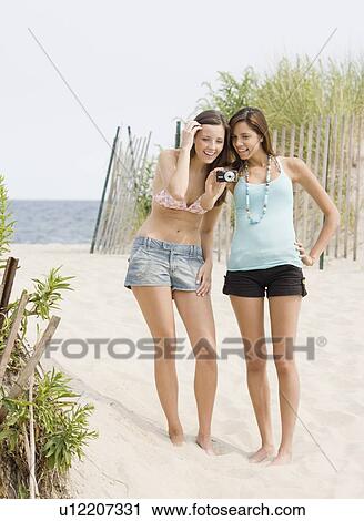 Young women looking at camera View Large Photo Image Stock Image - Young women looking at camera. Fotosearch