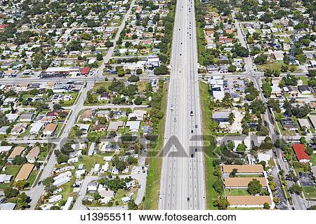 Stock Image - Aerial view of highway through residential area, Florida, United States. Fotosearch