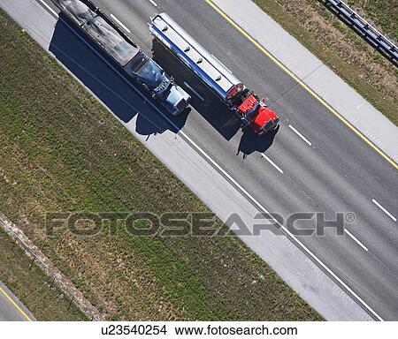aerial view of trucks on highway View Large Photo Image Picture - aerial view of trucks on highway. Fotosearch