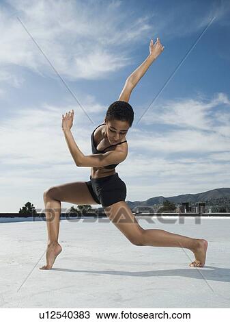 Stock Image - African female ballet dancer dancing. Fotosearch