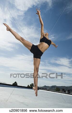 Stock Photograph - African female ballet dancer jumping. Fotosearch