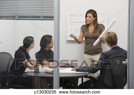 Stock Photography - Architects meeting n conference room. Fotosearch