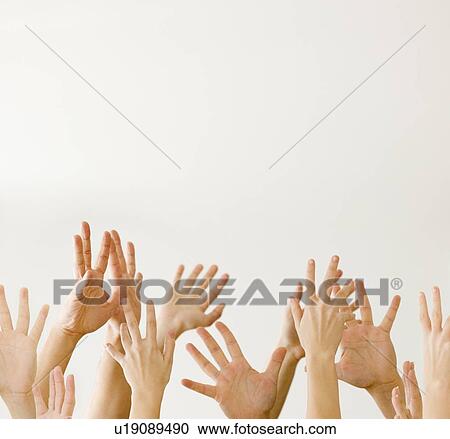 Stock Image - Assorted hands reaching up. Fotosearch