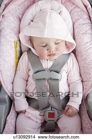 Baby sleeping in car seat View Large Photo Image Picture - Baby sleeping in car seat. Fotosearch