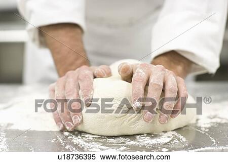Baker kneading bread dough View Large Photo Image Stock Photography - Baker kneading bread dough. Fotosearch
