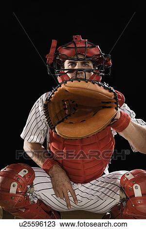 Stock Image - Baseball catcher signaling. Fotosearch