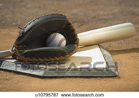 Baseball equipment on home plate View Large Photo Image Stock Photo - Baseball equipment on home plate. Fotosearch