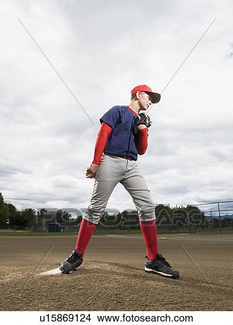 Picture - Baseball pitcher getting ready to throw ball. Fotosearch