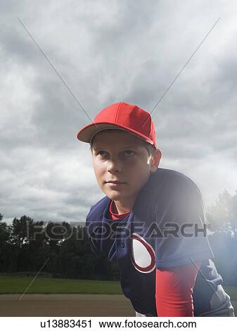Stock Image - Baseball pitcher getting ready to throw ball. Fotosearch