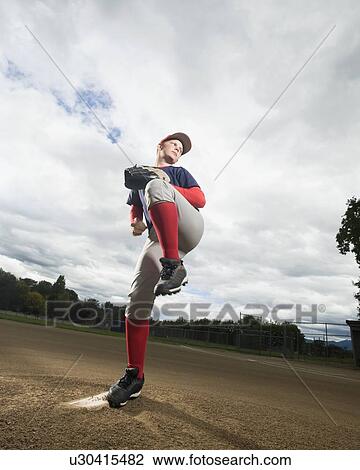 Baseball pitcher getting ready to throw ball View Large Photo Image Stock Image - Baseball pitcher getting ready to throw ball. Fotosearch