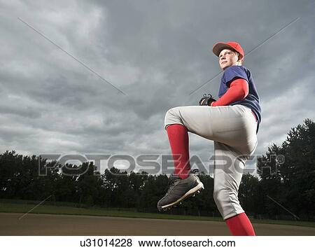 Baseball pitcher getting ready to throw ball View Large Photo Image Stock Photo - Baseball pitcher getting ready to throw ball. Fotosearch